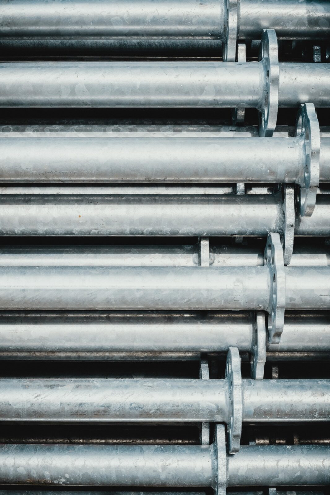 Gray steel rod lot in industrial setting for Epo-Weld™ HTE high-temperature epoxy surface rebuilding and repair