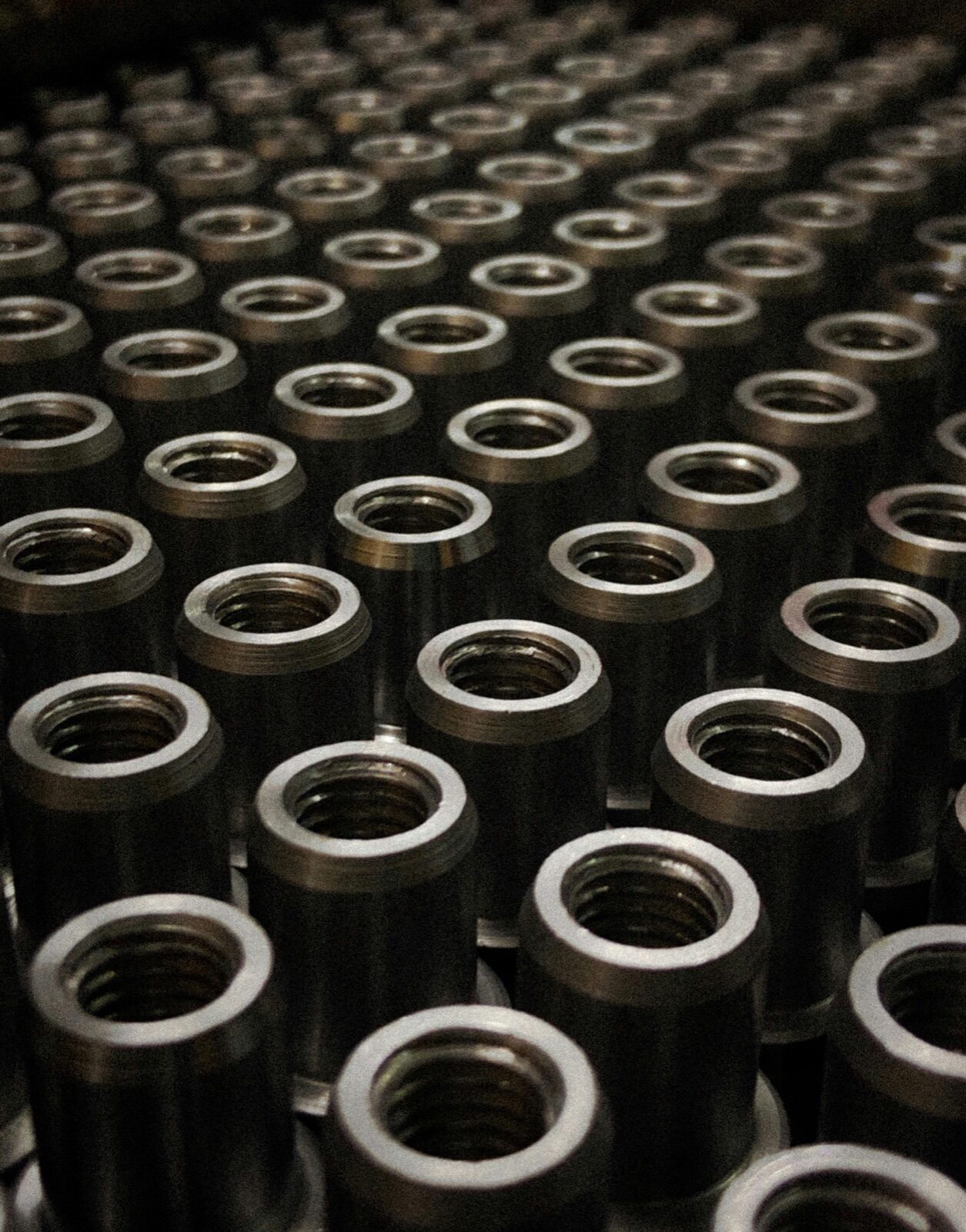 Rows of machined threaded metal couplings for Epo-Weld™ UHTE ultra high temperature epoxy dissimilar material bonding