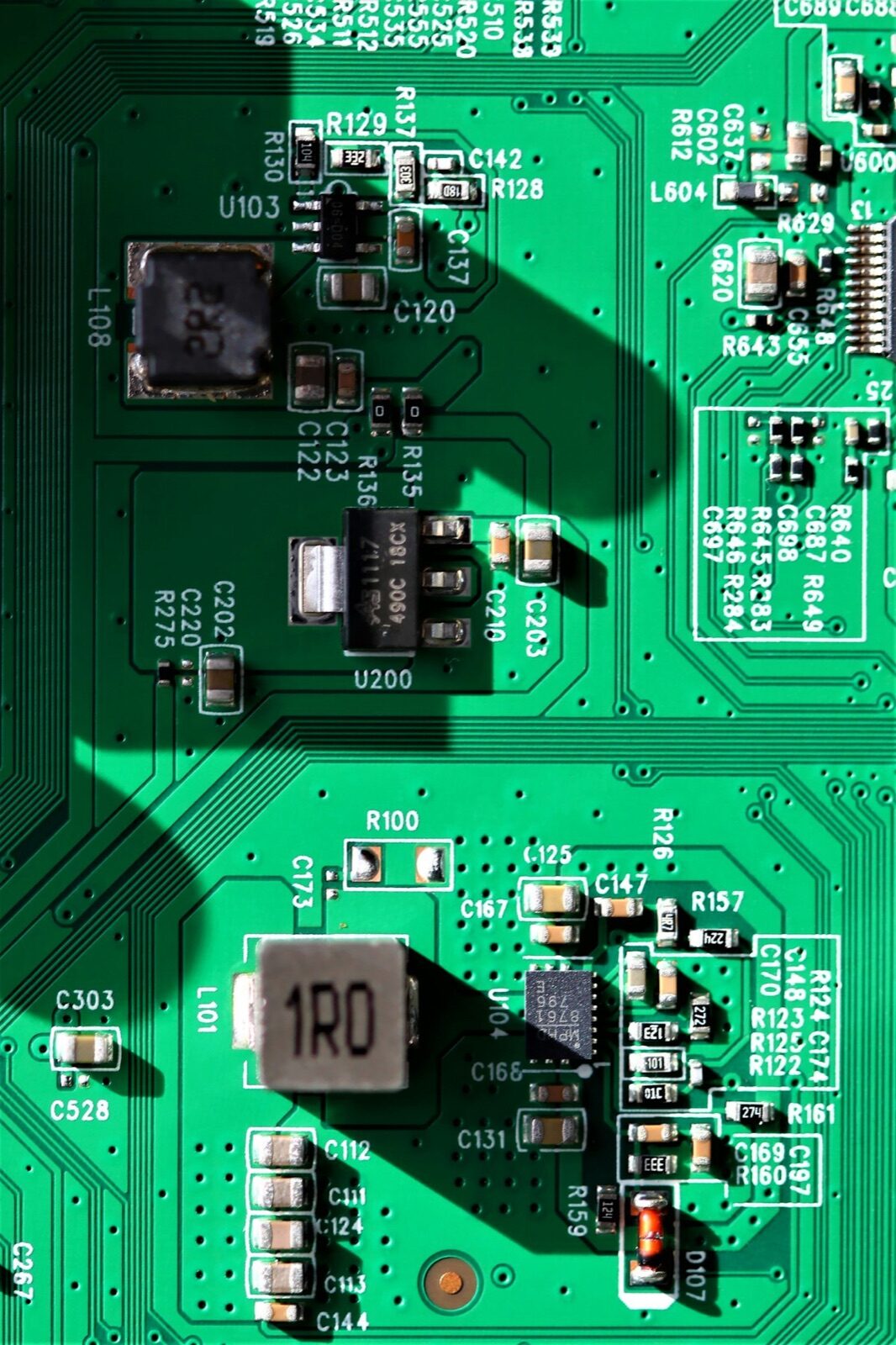 Green PCB with SMD components coated with Ultra-Illumina™ UV conformal coating for moisture protection