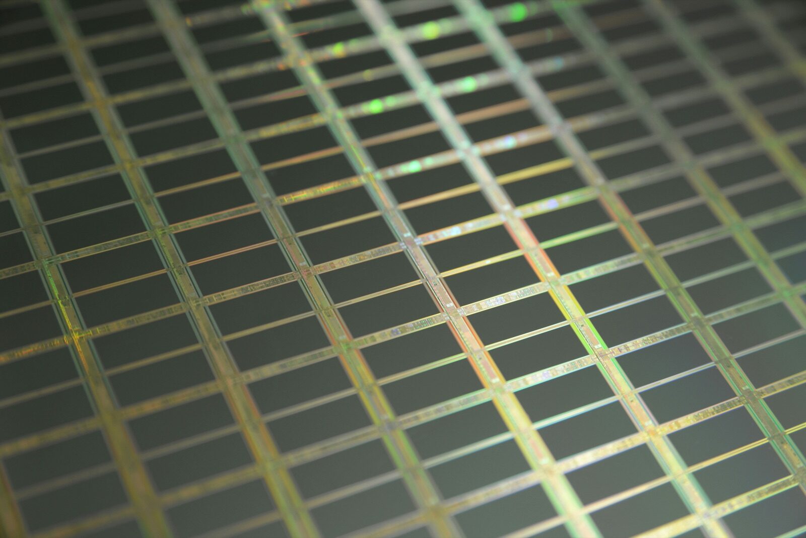 Silicon wafer die grid showing semiconductor circuit patterns for Pyra-Sil™ UV silicone conformal coating on PCBA
